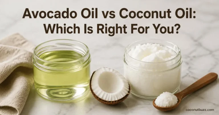 Side by side clear jars of avocado oil and solid coconut oil with halved coconut piece on light marble background