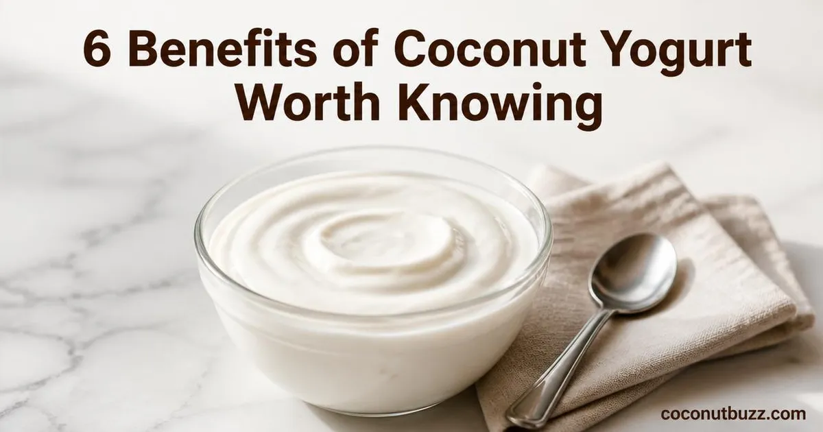 creamy thick coconut yogurt in a glass bowl on light marble surface with spoon and linen napkin
