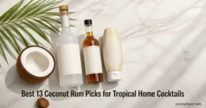Coconut rum bottles (zero-proof and toasted syrup) plus squeezable cream bottle, halved coconut and palm leaf on light marble