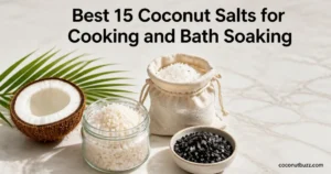 coconut salt jar, muslin bag and small bowl of charcoal Hawaiian salt with halved coconut and palm leaf on light marble